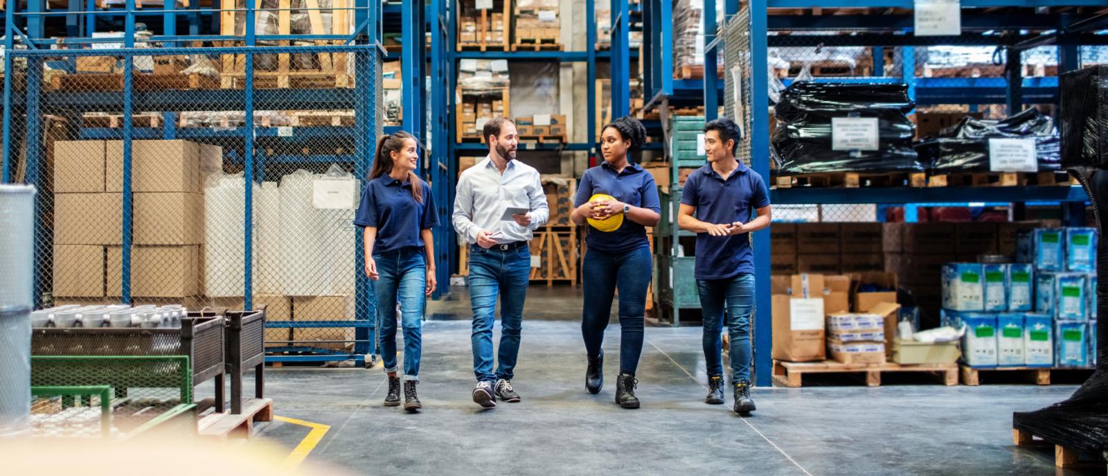 Workers in a large warehouse